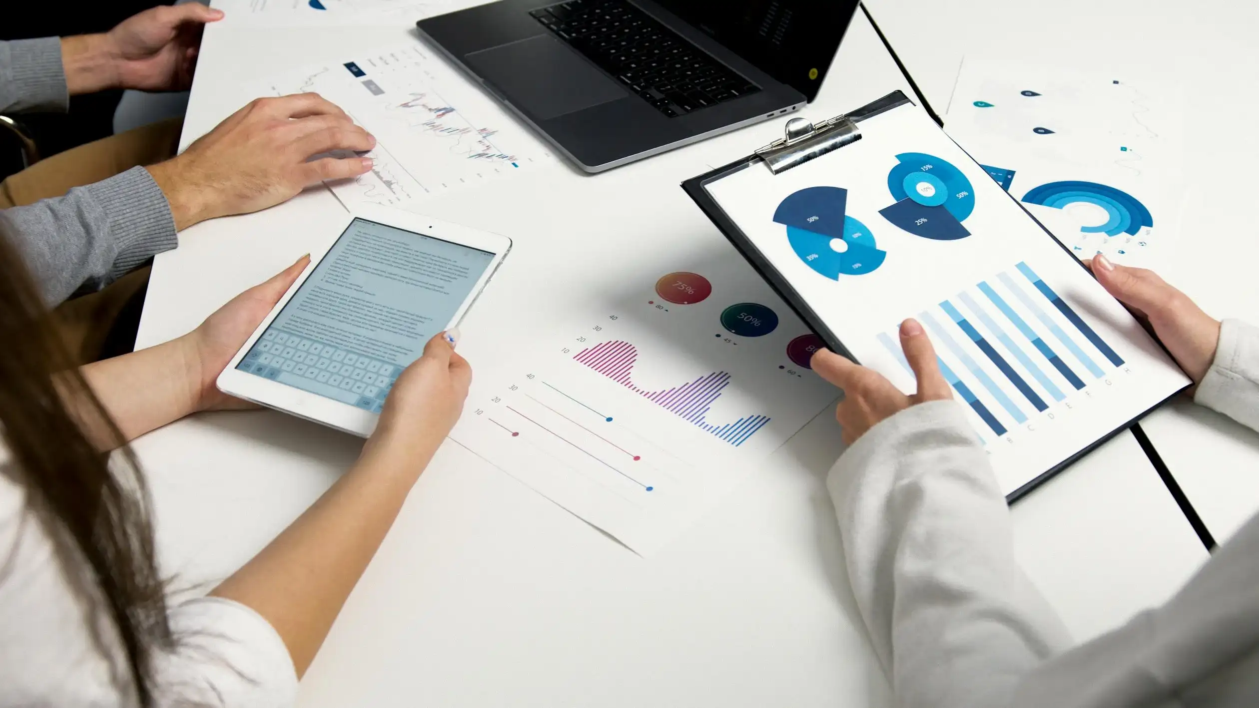 A marketing team analyzing their marketing campaign reports for marketing expert in qatar